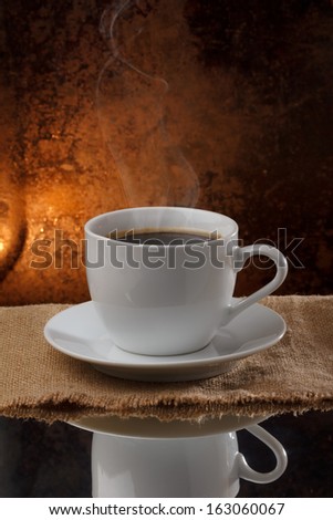 Cup of hot coffee with steam