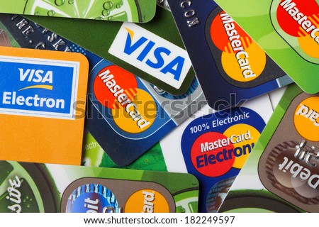 KIEV, UKRAINE - March 11: Pile of credit cards, Visa and MasterCard, credit, debit and electronic, in Kiev, Ukraine, on March 11, 2014.