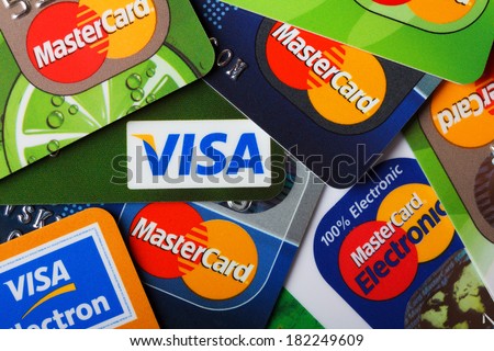 KIEV, UKRAINE - March 11: Pile of credit cards, Visa and MasterCard, credit, debit and electronic, in Kiev, Ukraine, on March 11, 2014.