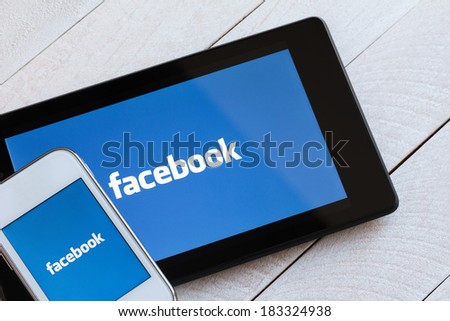 KIEV, UKRAINE - March 22: Facebook social network logo on tablet and smartphone, in Kiev, Ukraine, on March 22, 2014.