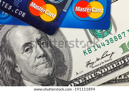 KIEV, UKRAINE - May 5: MasterCard credit cards with US dollar bills, in Kiev, Ukraine, on May 5, 2014.