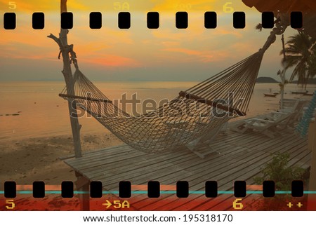 Hammock on tropical beach at sunset, retro stylized and stained