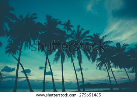 Retro stylized palm trees on tropical beach