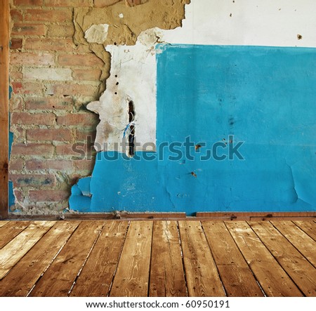 abandoned room with old painted brick wall