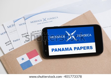 KRAKOW, POLAND - APRIL 6, 2016 : Folder with Mossack Fonseca logo and printed documents from it's web site and phone with Mossack Fonseca logo and Panama Papers text.