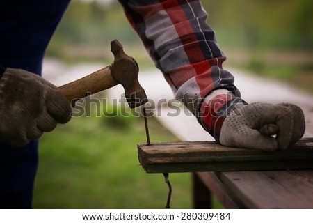 installation work to hammer a nail