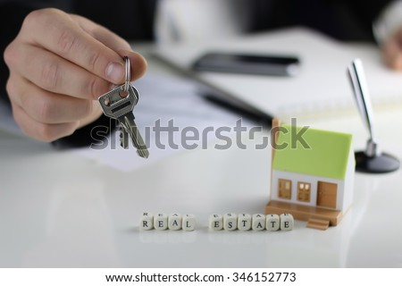 House Agents hands a contract