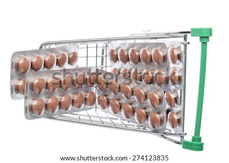 Shop cart with brown pills blisters on an white background