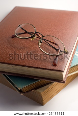 Study scene old books and glasses white background antique vintage old older elder reading studying read wisdom learning pages chapters stories history