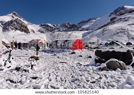 MENDOZA, ARGENTINA - JAN 14: Plaza de Mulas base camp covered of snow in summer. This year, 35000 people faced the mountain intend to get the summit. Jan 14, 2012 in Aconcagua Mount, Mendoza, Argentina.