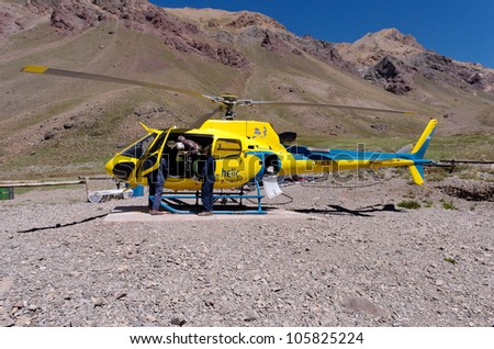 MENDOZA, ARGENTINA - JAN 11: Rescue Helicopter at the base of Aconcagua. Org. help manage the risk of climbing. This season 203 people were evacuated. Jan 11, 2012 in Aconcagua Mount, Mendoza, Argentina