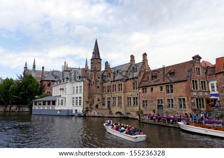 BRUGES, BELGIUM - SEPTEMBER 14: Houses along the canals of Brugge or Bruges, Belgium on Sep 14 2012. Bruges is frequently referred to as \