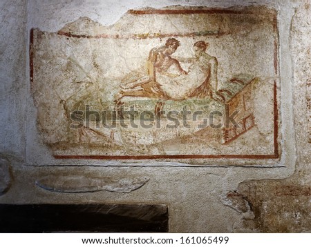 Pompeii -September 19. Ancient Fresco Of A Service Offered In A Brothel On September 19, 2012 In Pompeii, Italy. The Eruption Of 79 Ad Buried The City Preserving Details Of The Life In A Roman City.