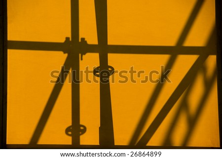 Back lighting of metallic structure on canvas