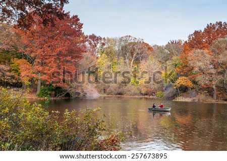 NEW YORK CITY, USA - NOVEMBER 14: Couple boating in autumn Central Park in New York City, New York, USA at November 14, 2011.