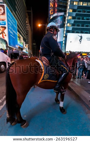 NEW YORK CITY, USA - NOVEMBER 20: Mounted NYPD Policemen on horses, on duty at night near Times Square at November 20, 2011, Manhattan, New York, USA.