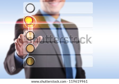 smiling business man choosing and pushing a button from a blank list of options