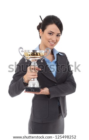 Portrait of an attractive young business woman winning a trophy against white background