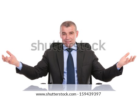 business man welcoming you with his arms open while sitting on his chair, at his desk. on a white background