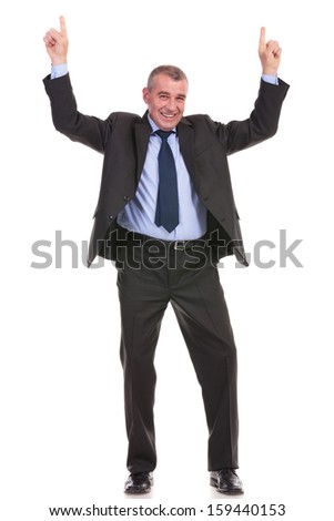 full length picture of a business man pointing upward with both hands while smiling for the camera. on a white background