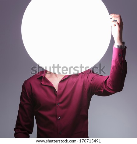 confused bright man is having a problem and scratches his big  ball head
