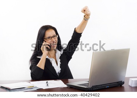 business woman at her office on phone winning something talking on the phone