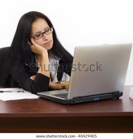 Tired businesswoman sleeping on the desk over white background