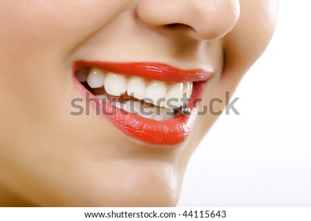 stock photo : closeup picture of a woman's tongue piercing over white