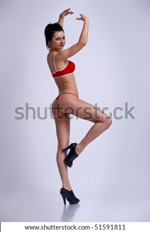 stock photo beautiful naked woman posing like a ballerina over white