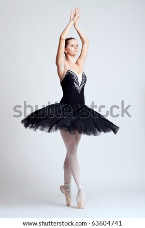 The beautiful young dancer. The ballerina posing.