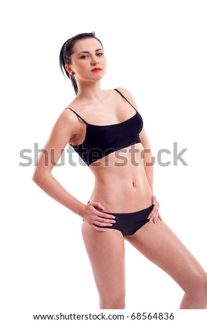 Sexy woman in a bikini with hand on hipps over white