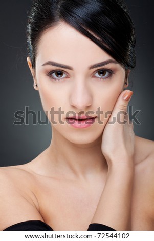 stock photo Portrait of a sexy young girl touching her face with hand 