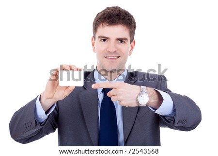 young attractive business man shows his business card, focus is on card, face is blurred, white empty copy space, studio shoot isolated on white