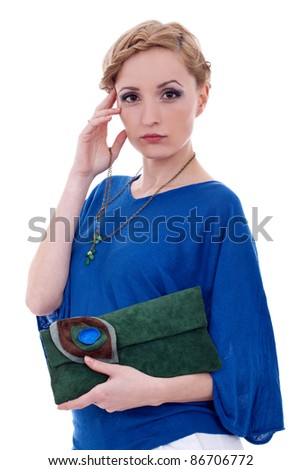 Approachable woman holding purse and necklace against white background