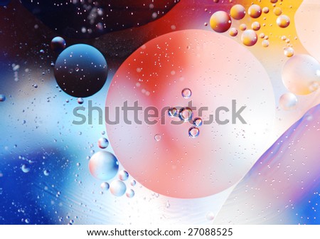 Micro photo of oil droplets and water on a colorful background