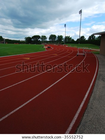 An empty running track on a gloomy day