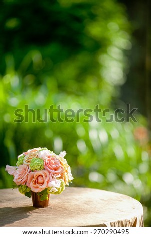 Flowers including Roses, mini Hydrangea, Sweet Pea on a table