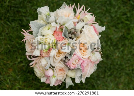 Wedding bouquet with Dusty Miller, Roses, Sweet pea, and Silver Brunia