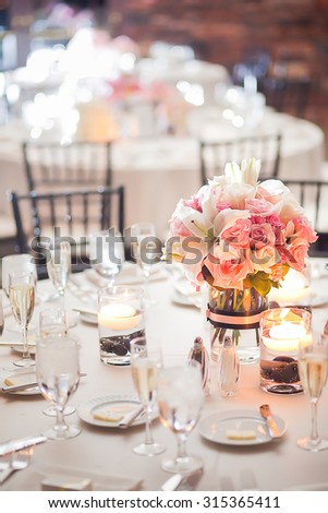 Floral centerpiece on a table at a wedding reception
