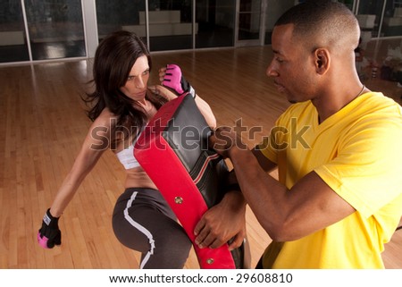 a woman trains at kickboxing or self defense