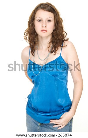 A beautiful young woman in a blue top and denim skirt
