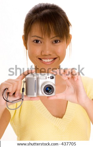 A pretty young asian girl with a point and shoot digital camera