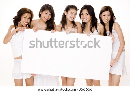 Five attractive young women in white hold a large blank sign
