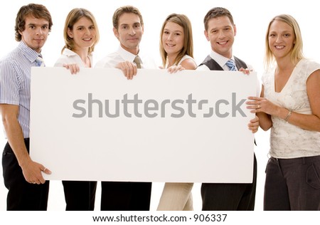 Six business men and women holding a big blank sign Six business men and women holding a big blank sign