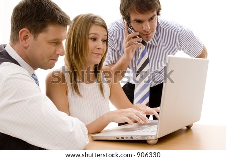 A small business team working on a laptop computer