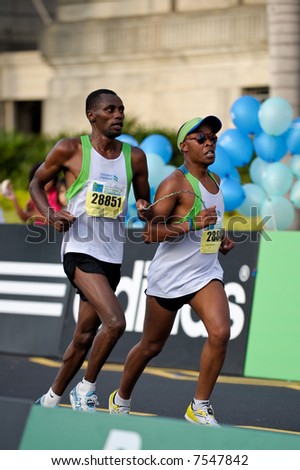 Blind Kenyan runner Henry Wanyoike with his guide Joseph Kibunja Gachui at the end of Singapore Marathon 2007