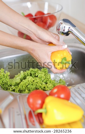 woman washing vegetable