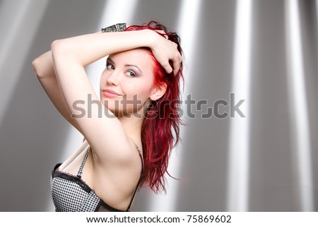 Pretty red haired woman looking back, copy space