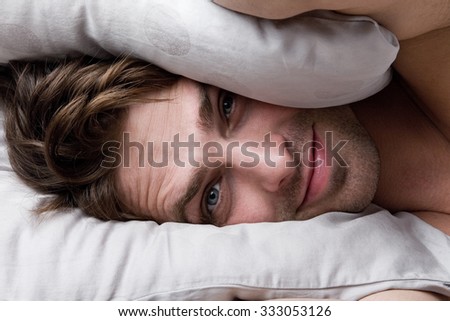 Young attractive man wakes up