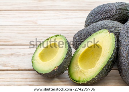 Avocados on a wood table